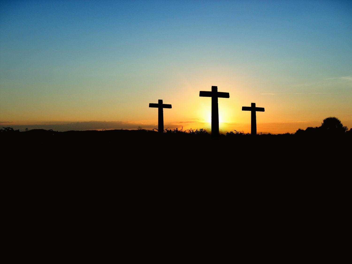 silhouette-photo-of-3-cross-under-the-blue-sky-70847